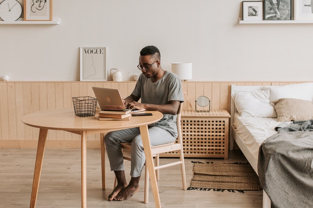 man working from home on laptop