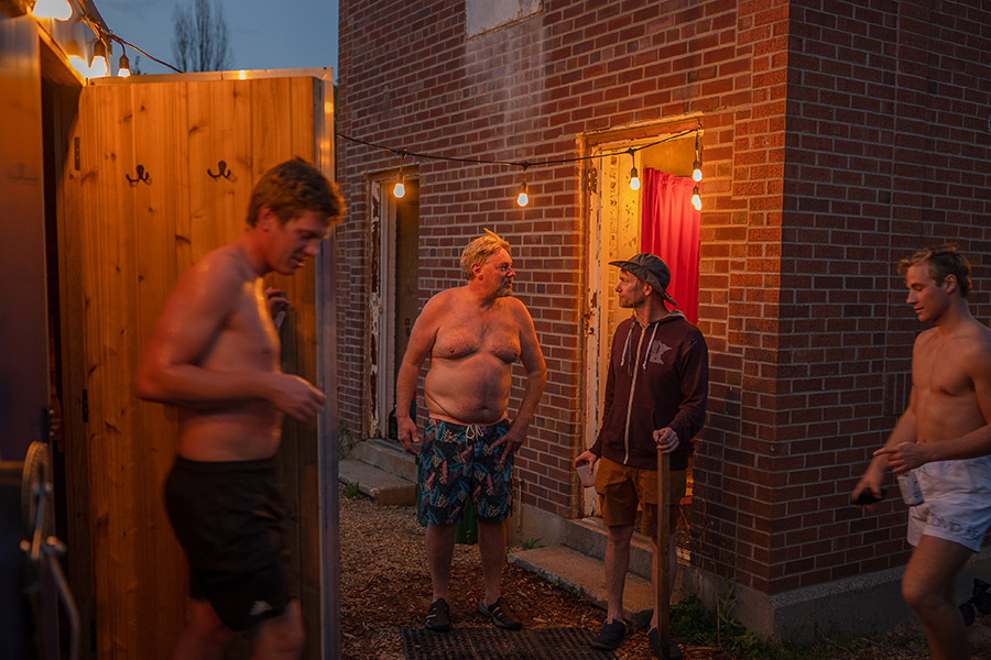 People talking around a mobile sauna