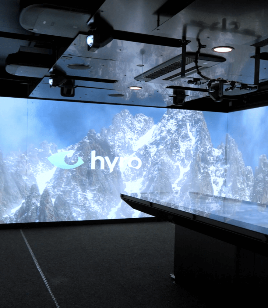 Man behind laptop using Hyro software. Visualizing that you can use the software anytime, anywhere, and from any device..