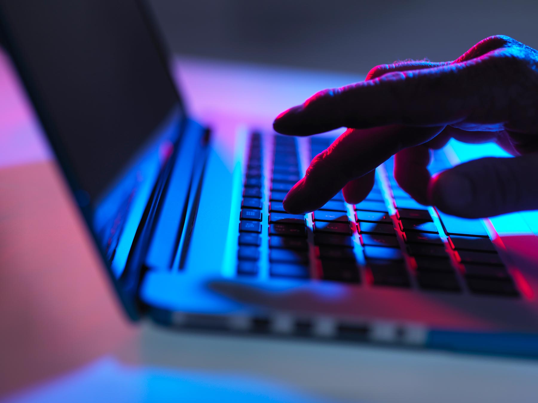 Cookie & Privacy Policy hero photographic header of man using a laptop.
