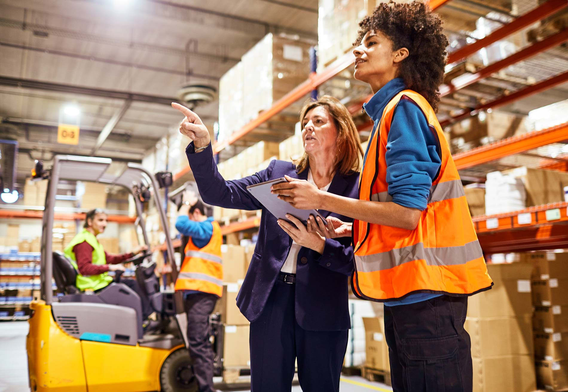 Retail manager in a warehouse hero image.