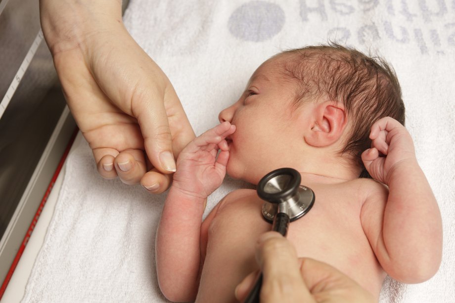 A baby having a newborn physical examination