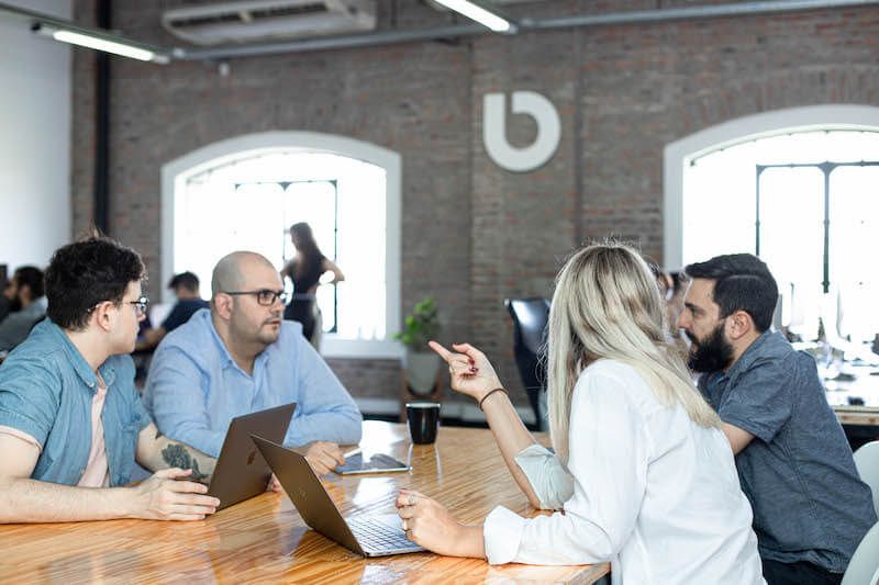 Meeting with four people in an office