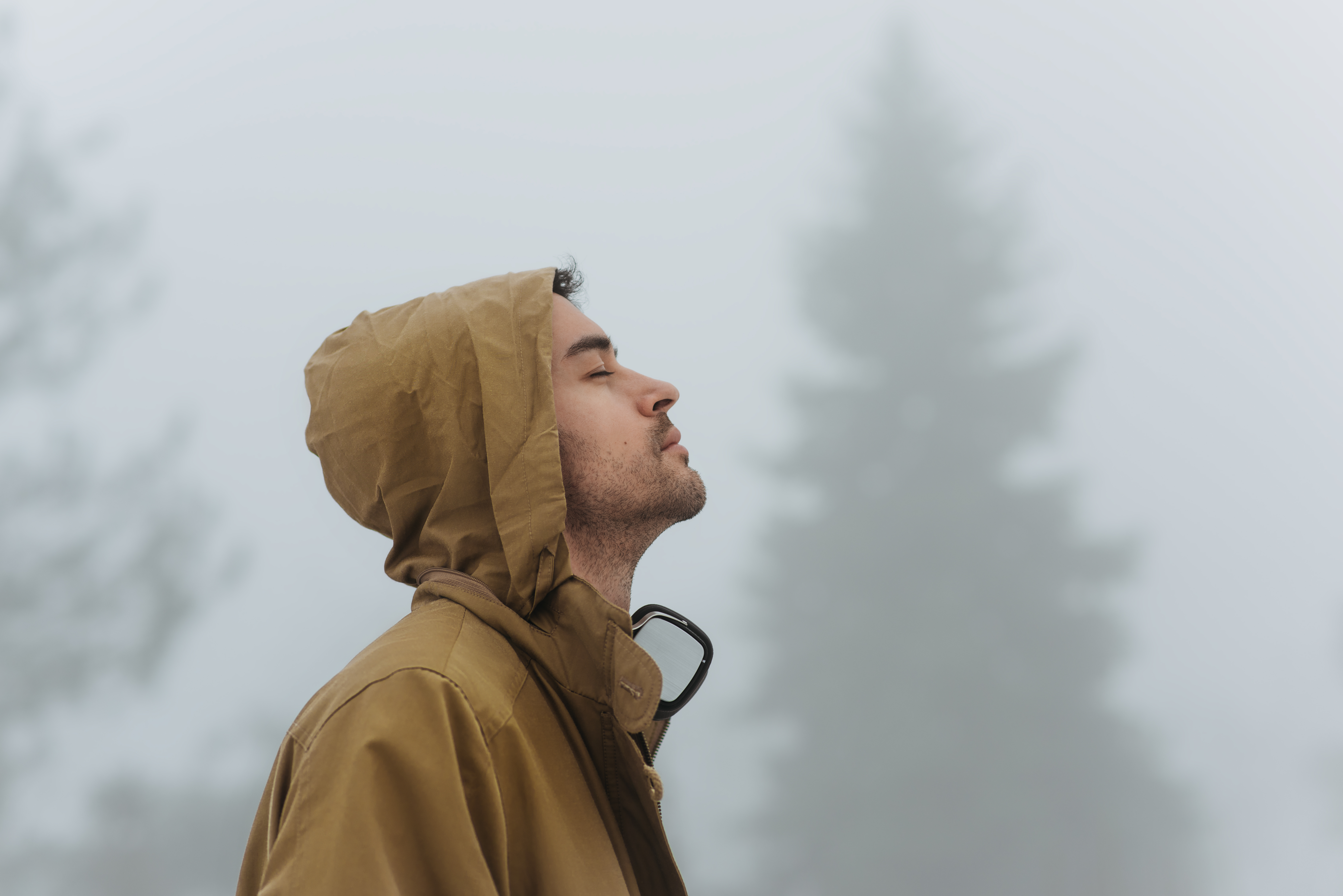 Man in nature in winter grateful