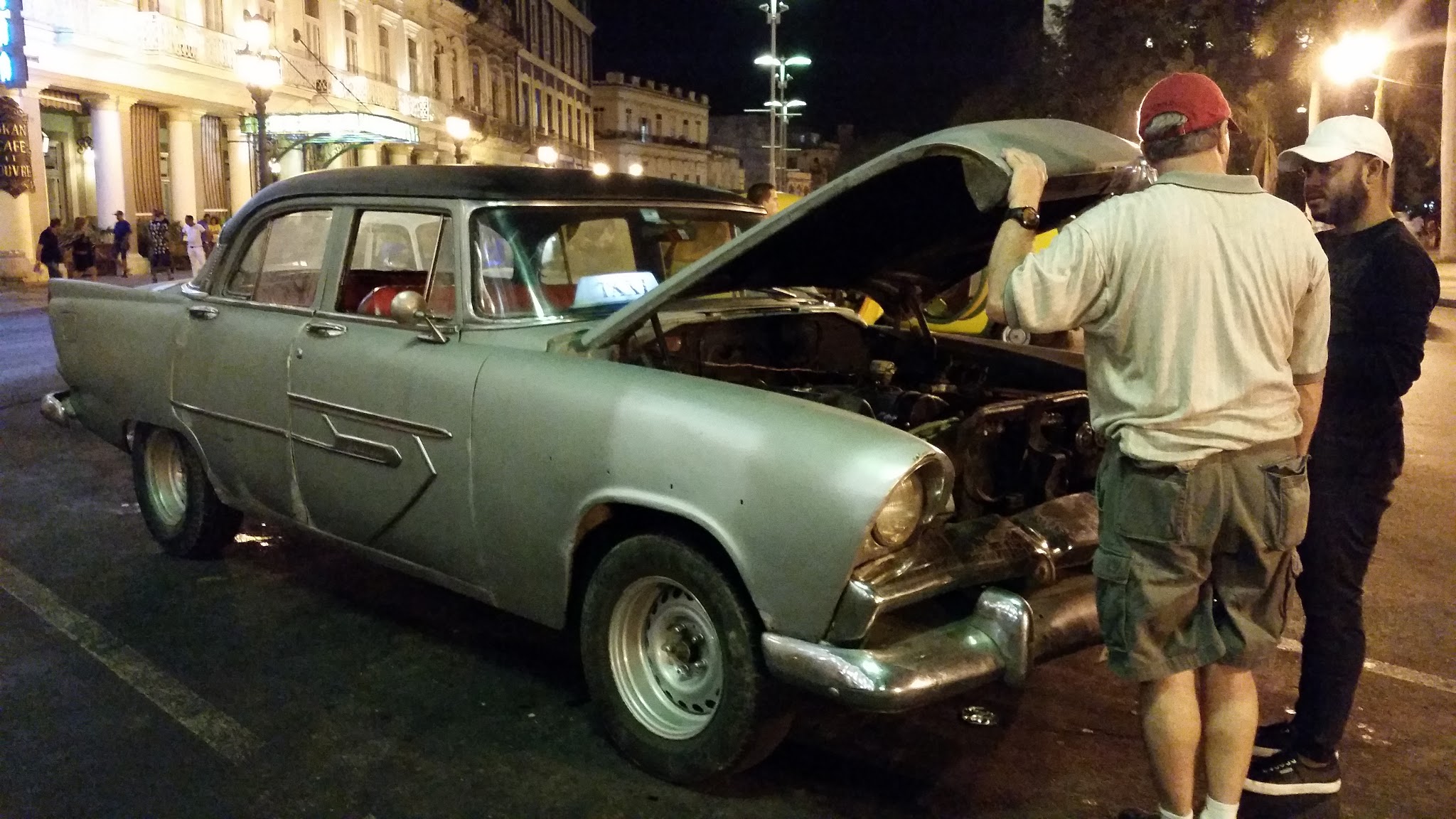 My dad chatting with a taxi driver while we explore Old Havana at night.