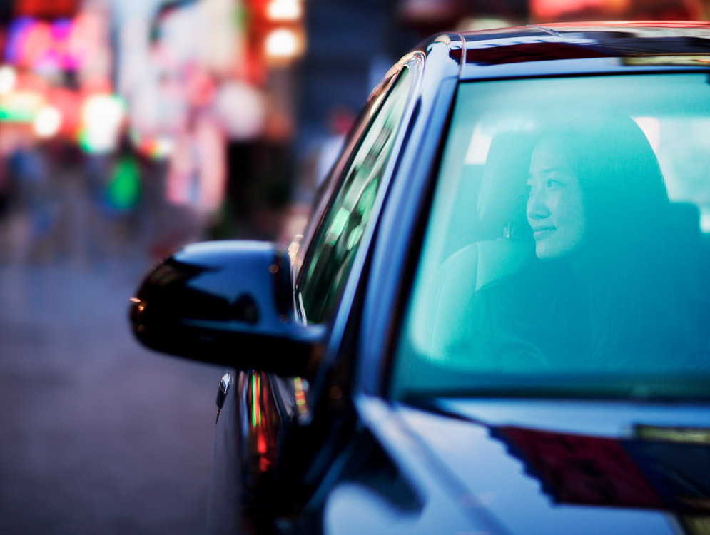 Happy person in her car.
