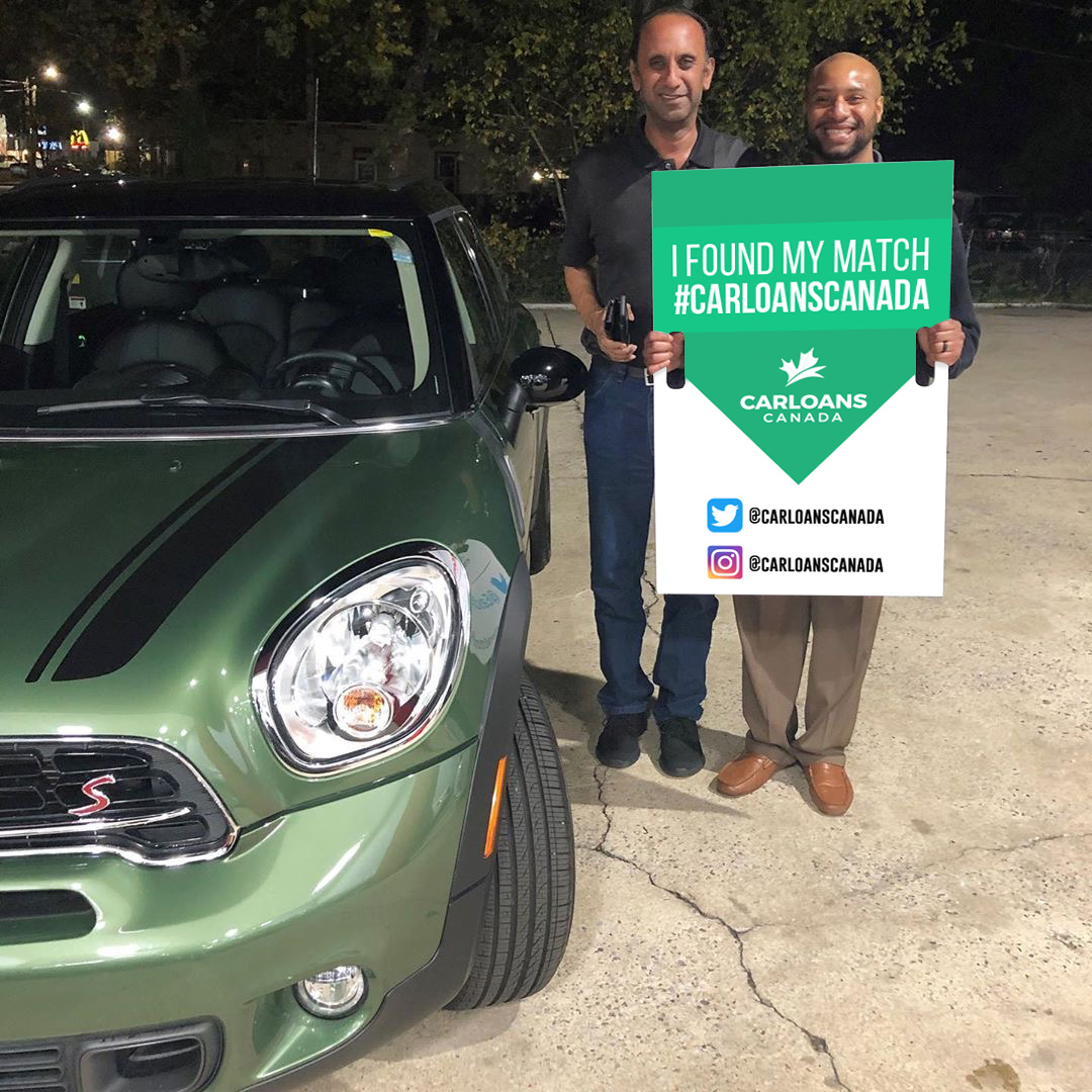 Men in front of car