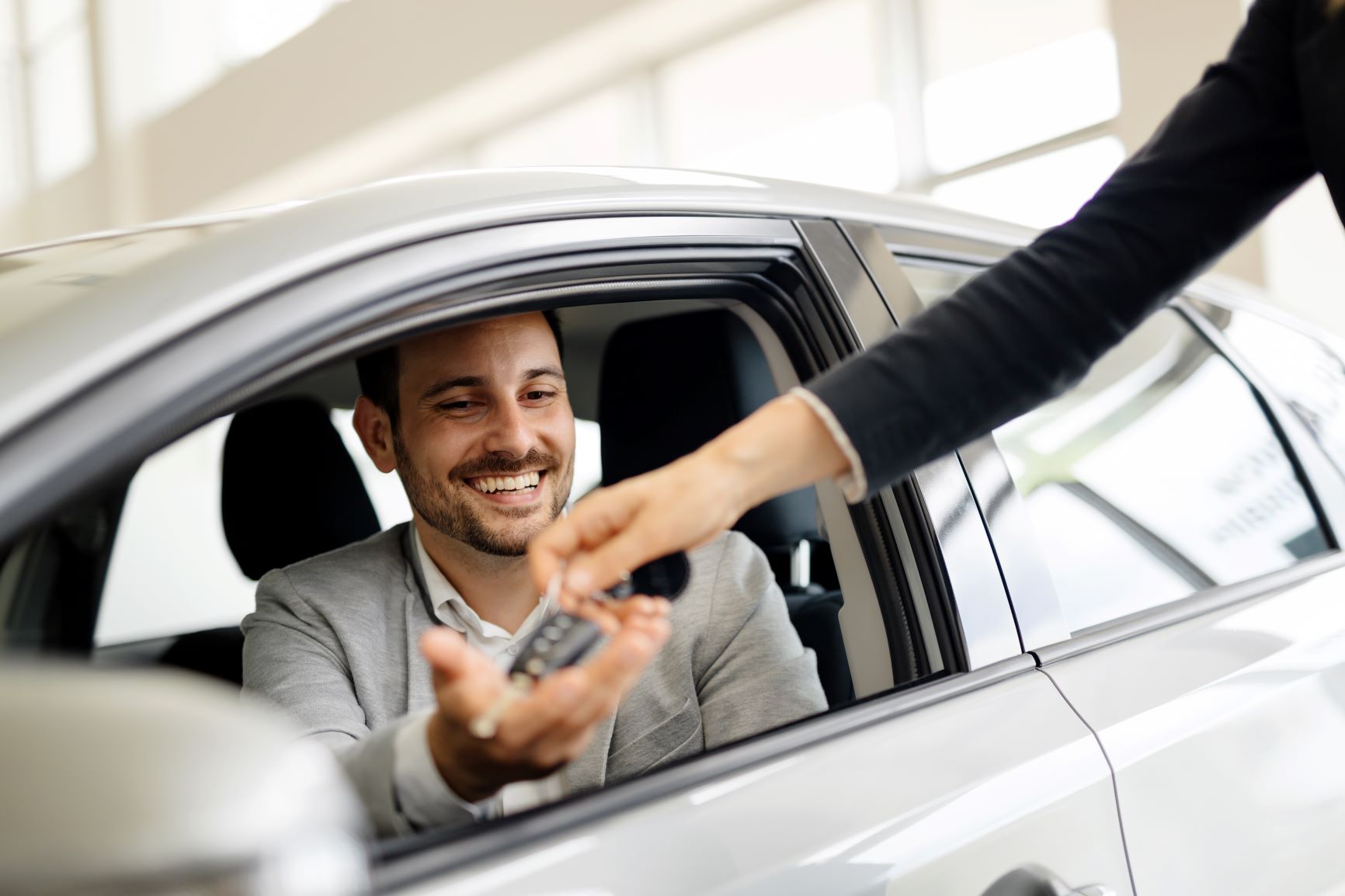 Man getting keys to car