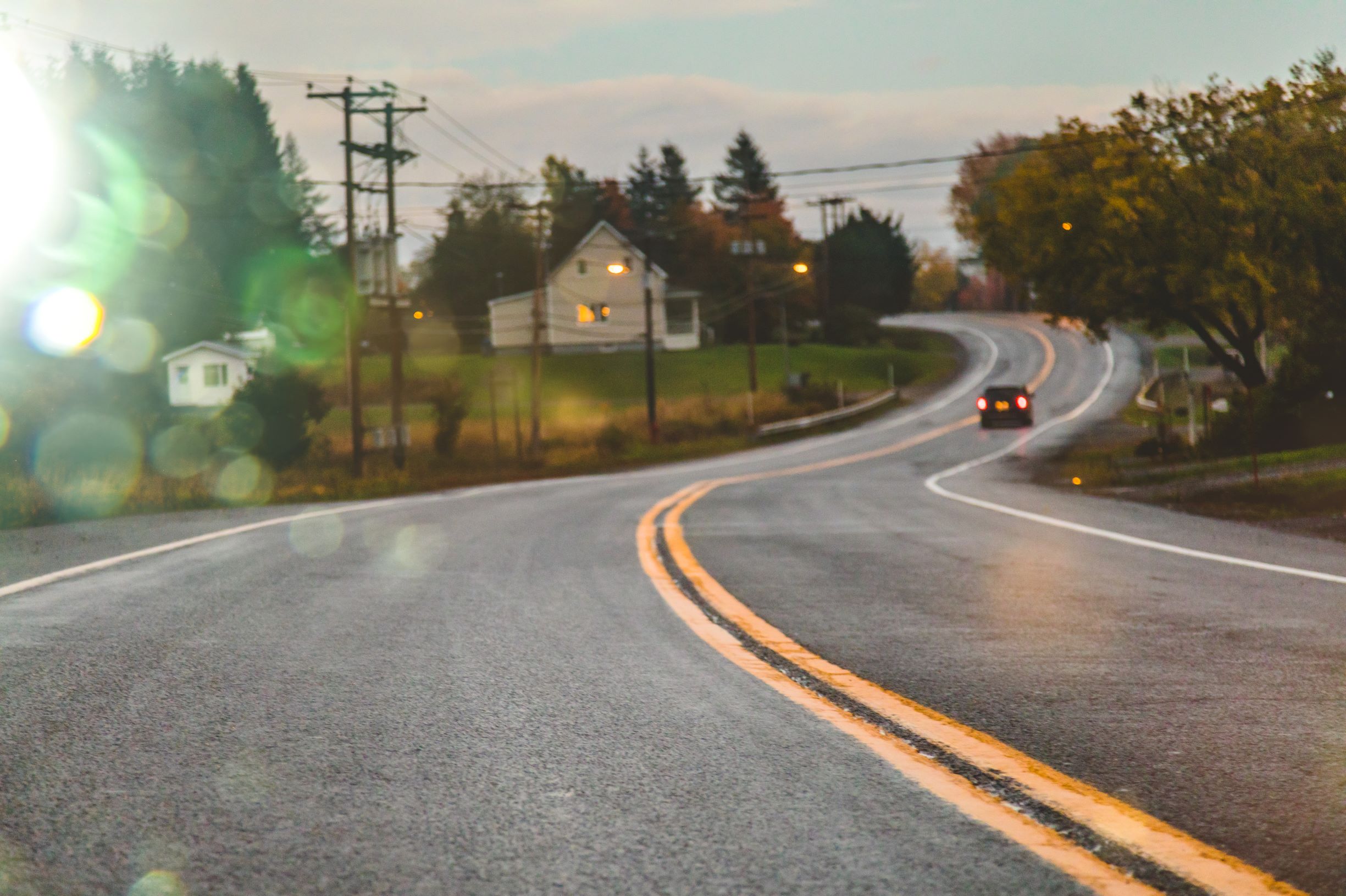 car on windy country road