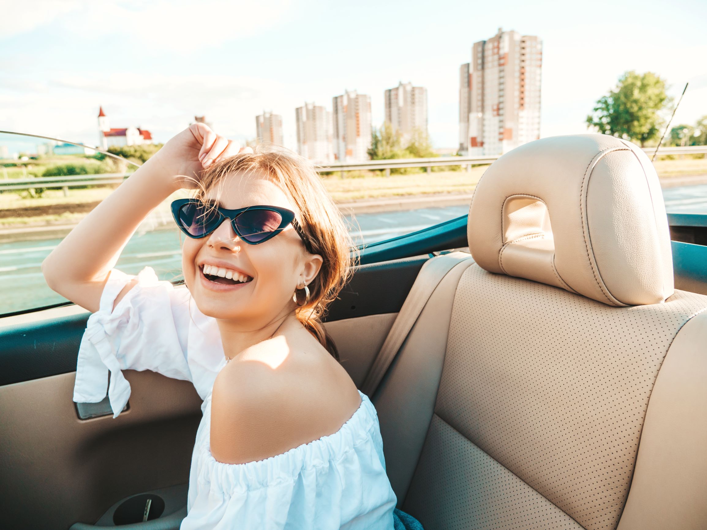 Woman in convertible car