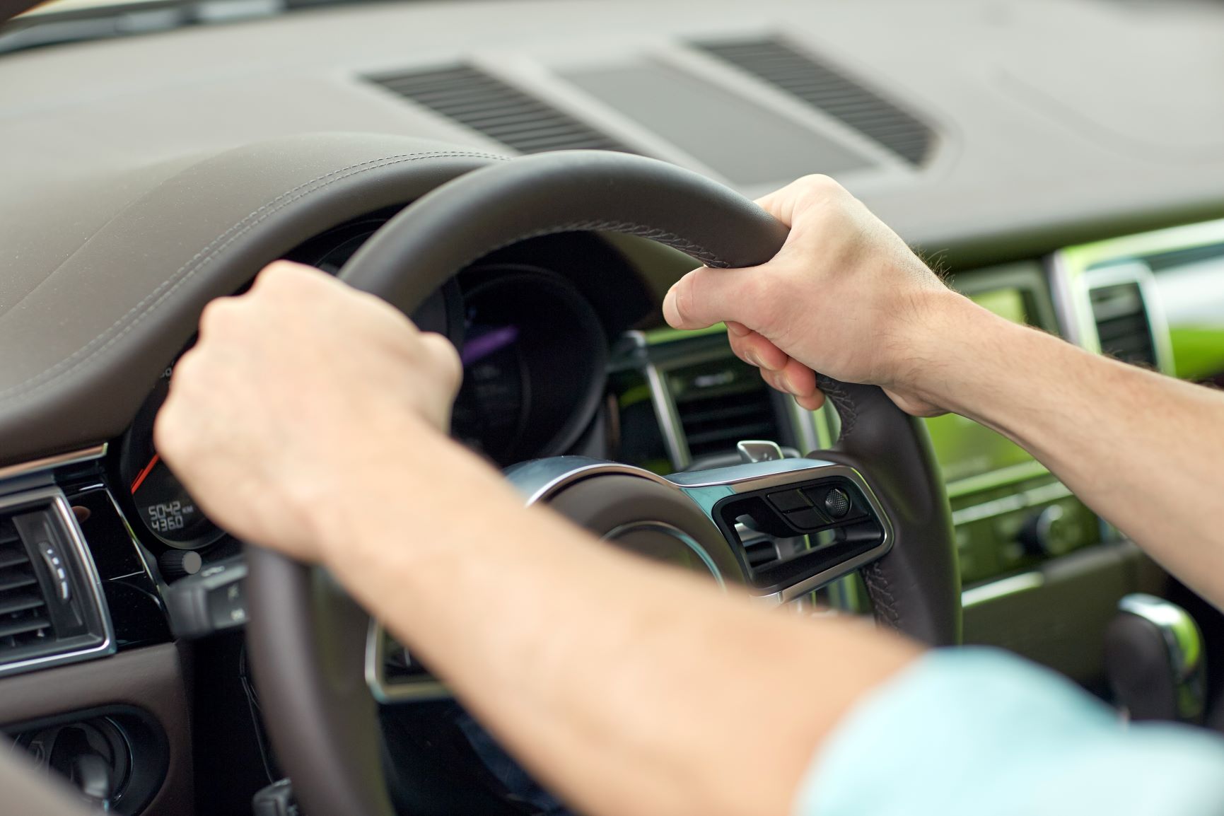 hands on a steering wheel