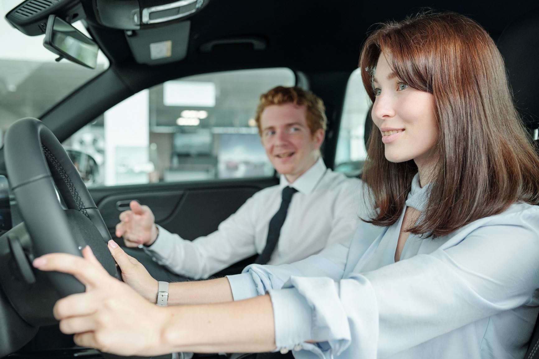 young girl test driving vehicle