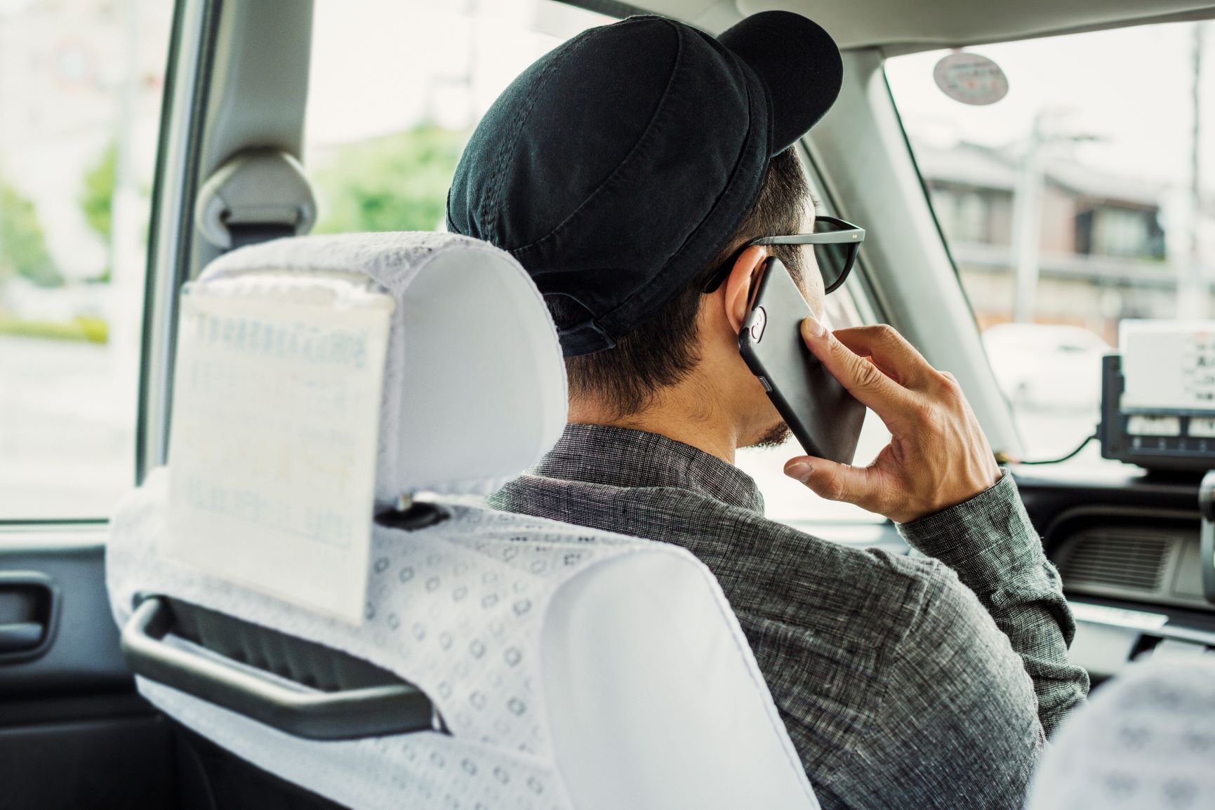 man on a phone call while driving
