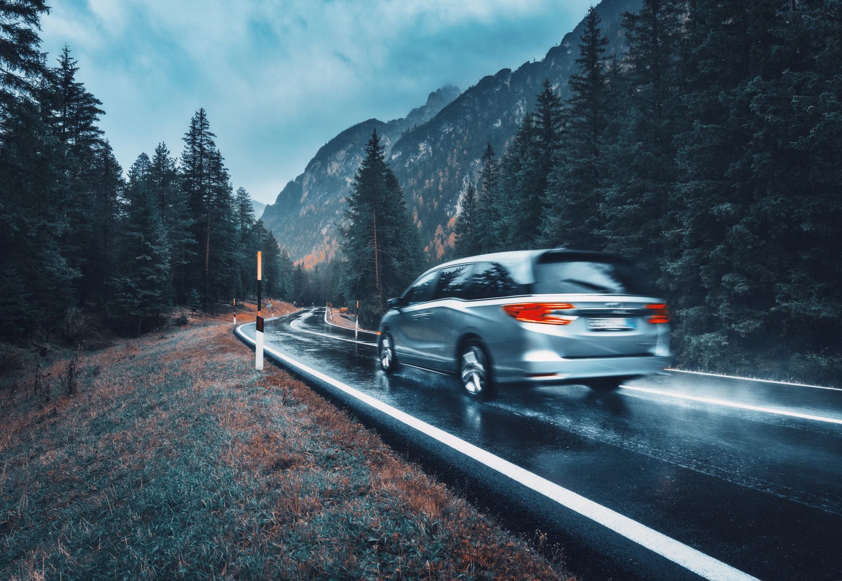 van driving on the road in the rockies