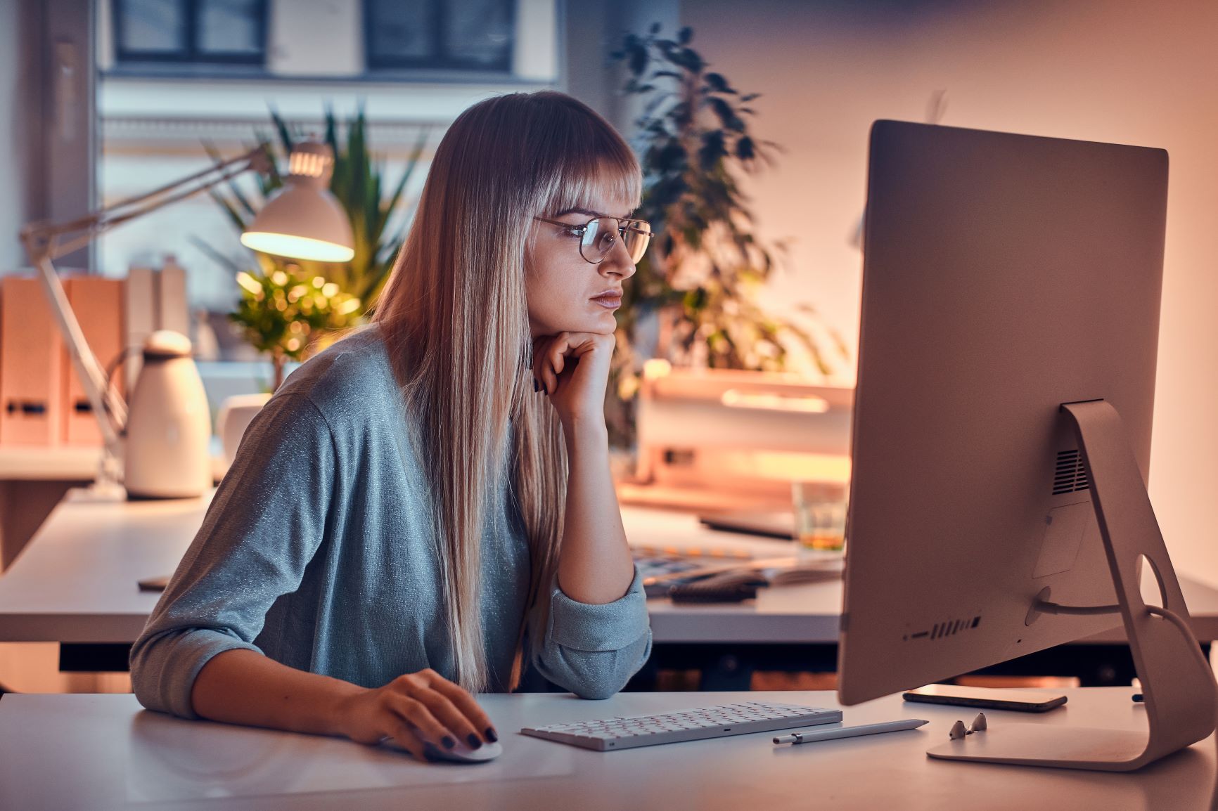 woman researching on her computer