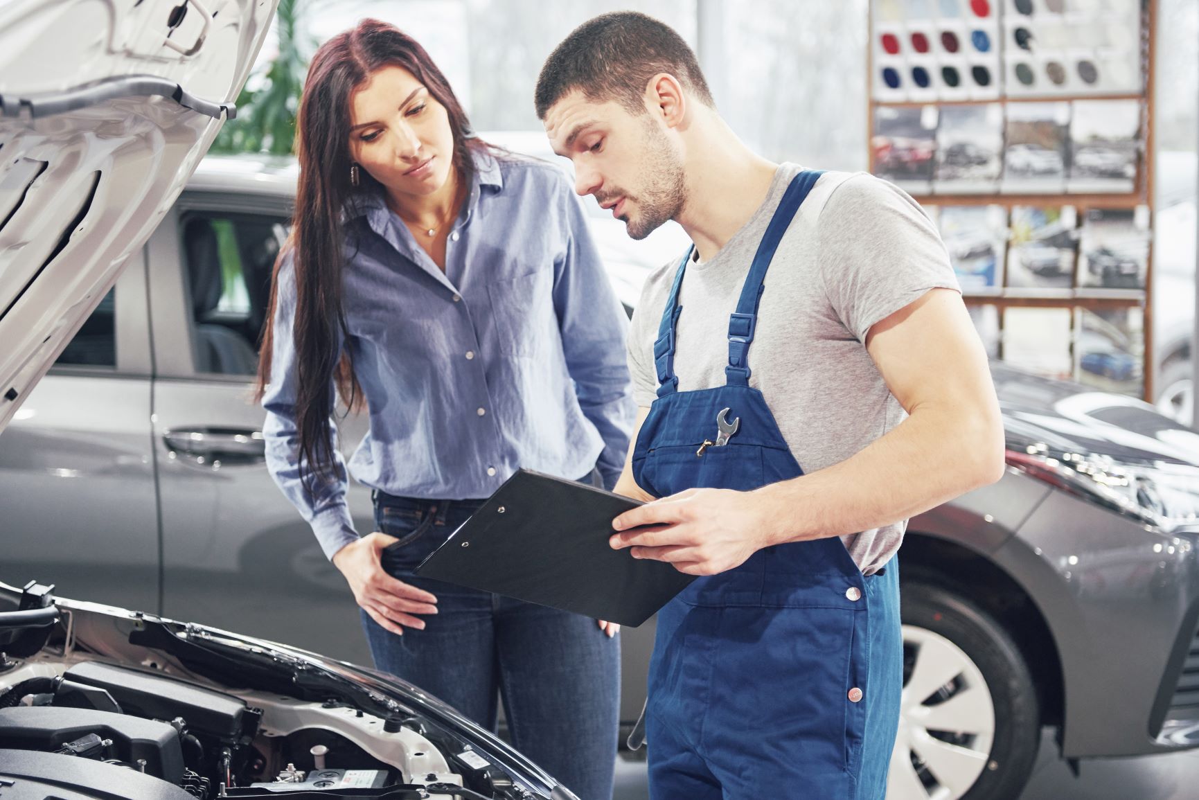 car mechanic with female customer