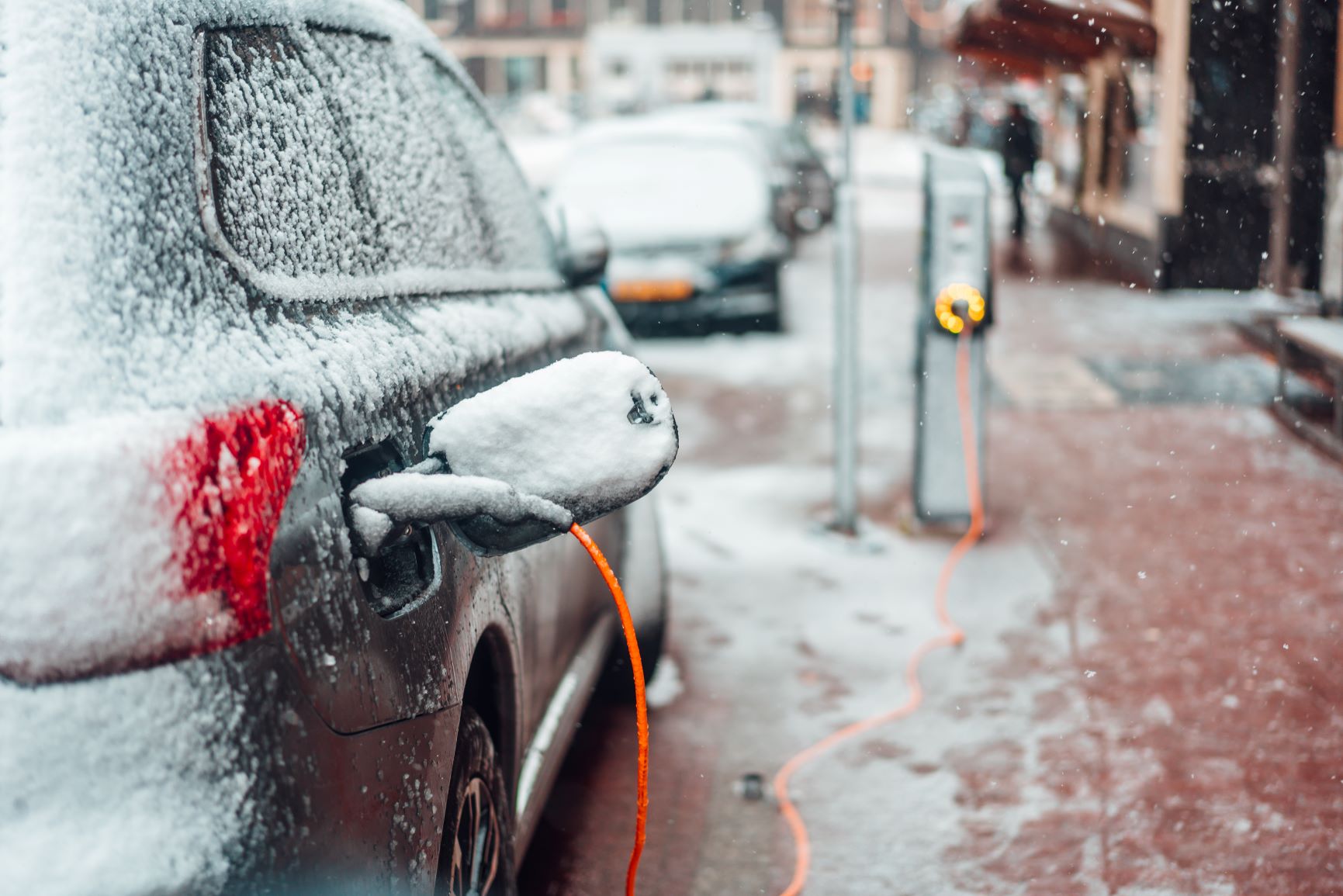 electric car plugged in winter