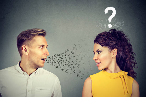 Man talking to an attractive woman with question mark voice therapy stock pictures, royalty-free photos & images