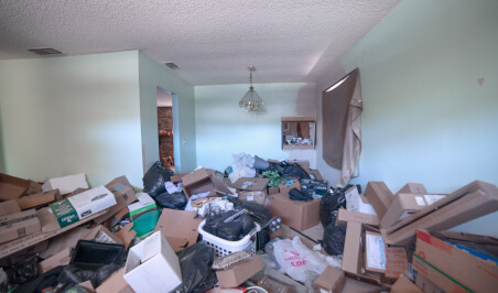 Trashed room filled with boxes