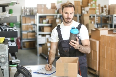 Man doing Quality Assurance of a returned product