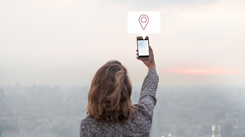 woman sharing her location via smartphone