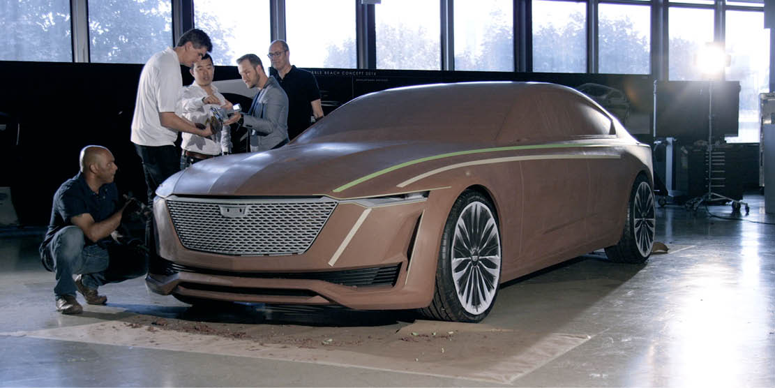 Clay modelers observe concept car