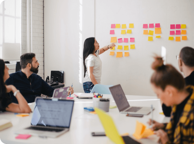 Group of people brainstorming in an office.