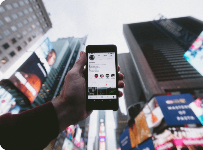 Image of a smartphone taken in a big city.