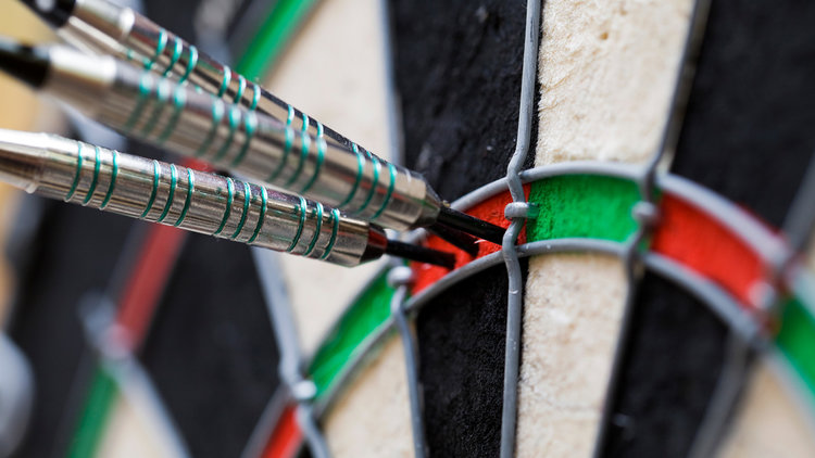 Group of darts in a dart boards.