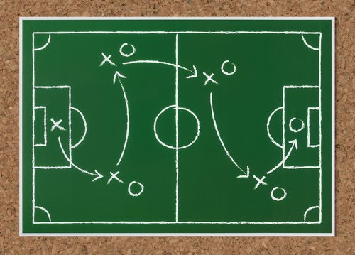 Image of a football play team.
