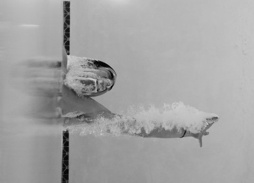 Man breaking through a barrier.