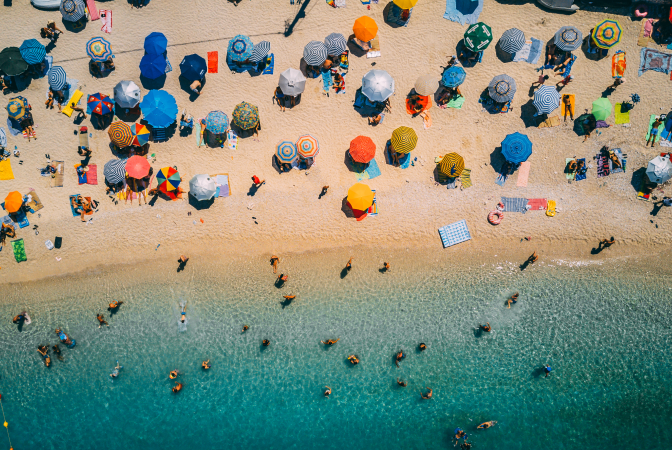 A large group of people vacationing on a beach