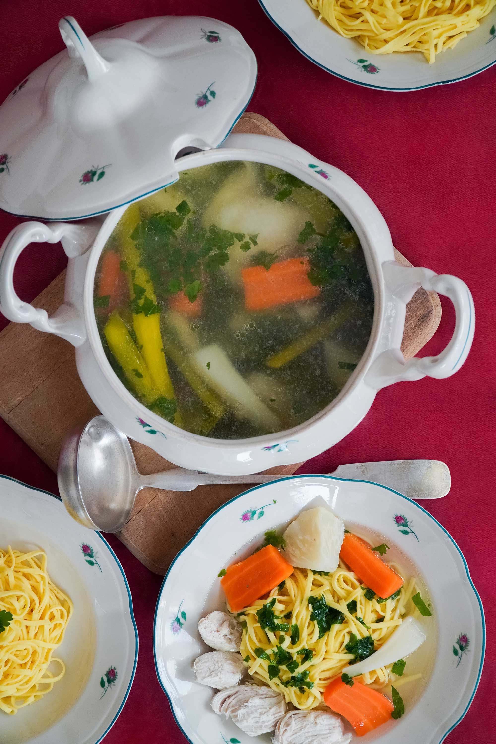 Chicken noodle soup in a bowl on a table