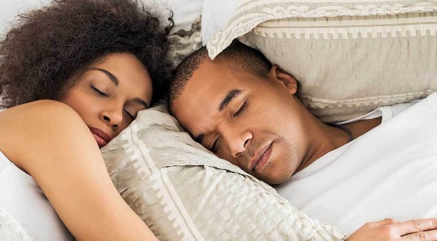 Couple sleeping in bed