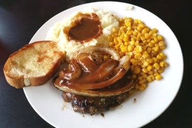Meat with mash potato corn and gravy