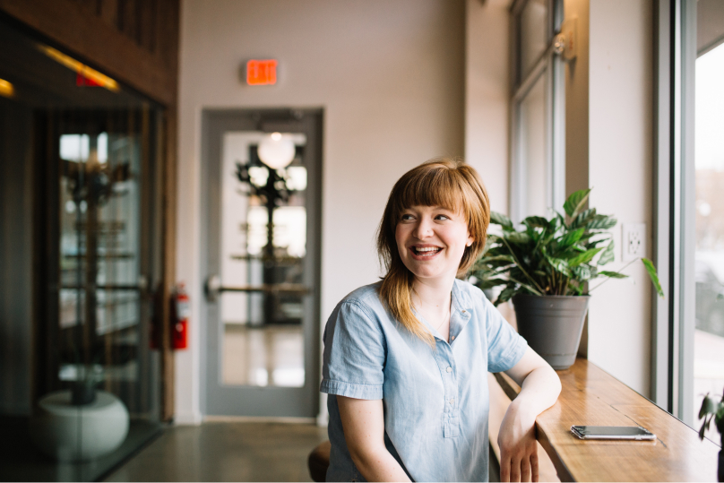 A woman smiling.