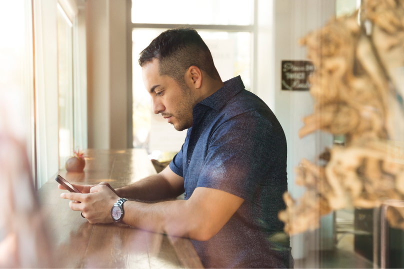 A man on his phone.