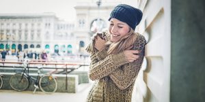 Beautiful woman enjoying winter in the city