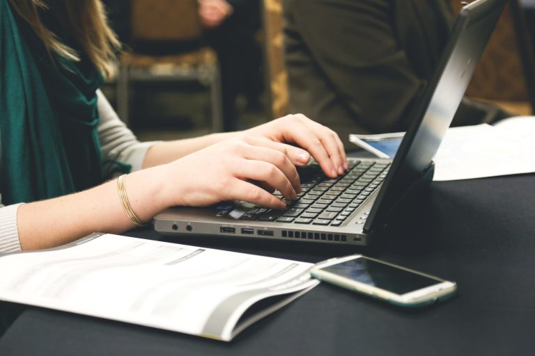 laptop-computer-typing-working-business-office-technology-desk-cell-phone-mobile-blogging-768x512