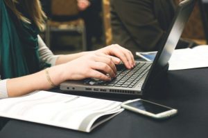 laptop-computer-typing-working-business-office-technology-desk-cell-phone-mobile-blogging-768x512