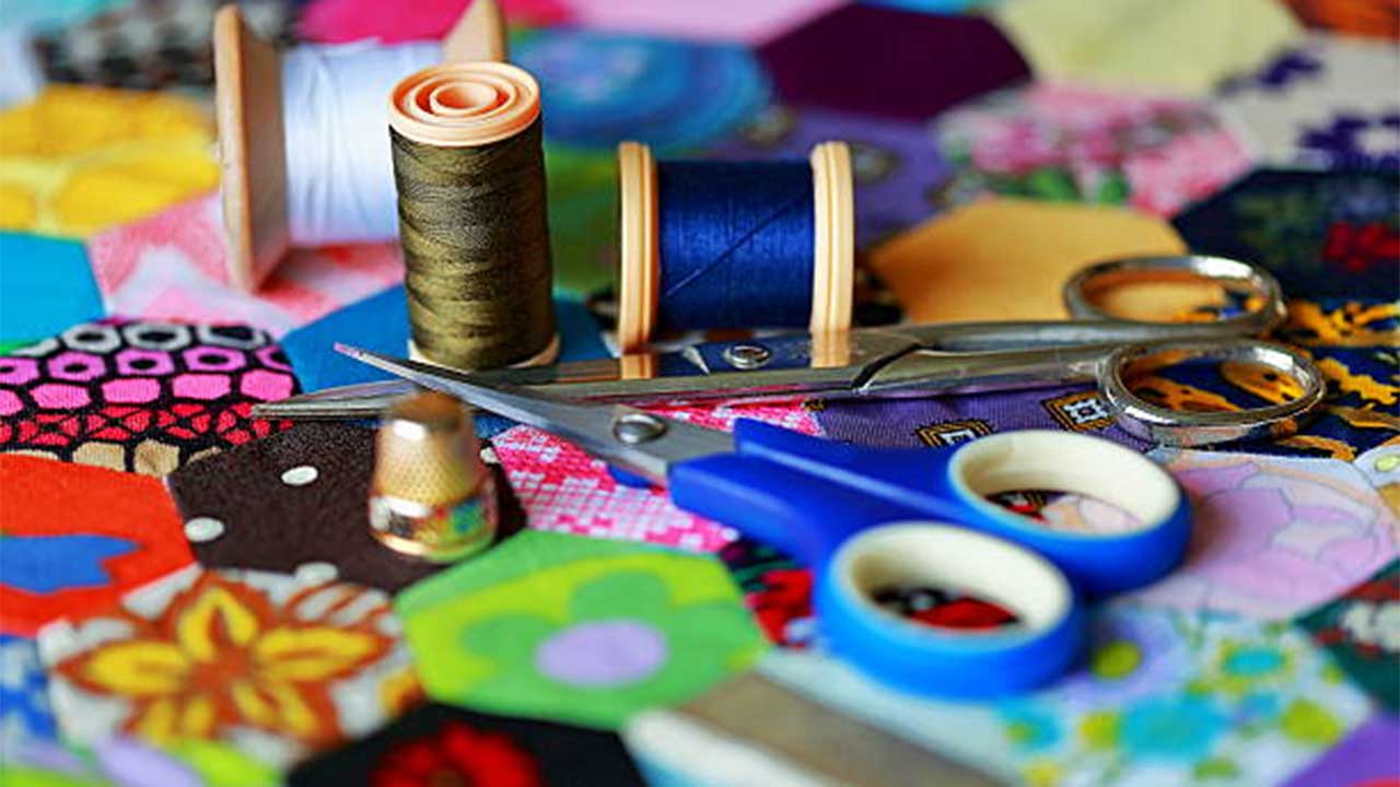 Bobbins and scissors and fabric
