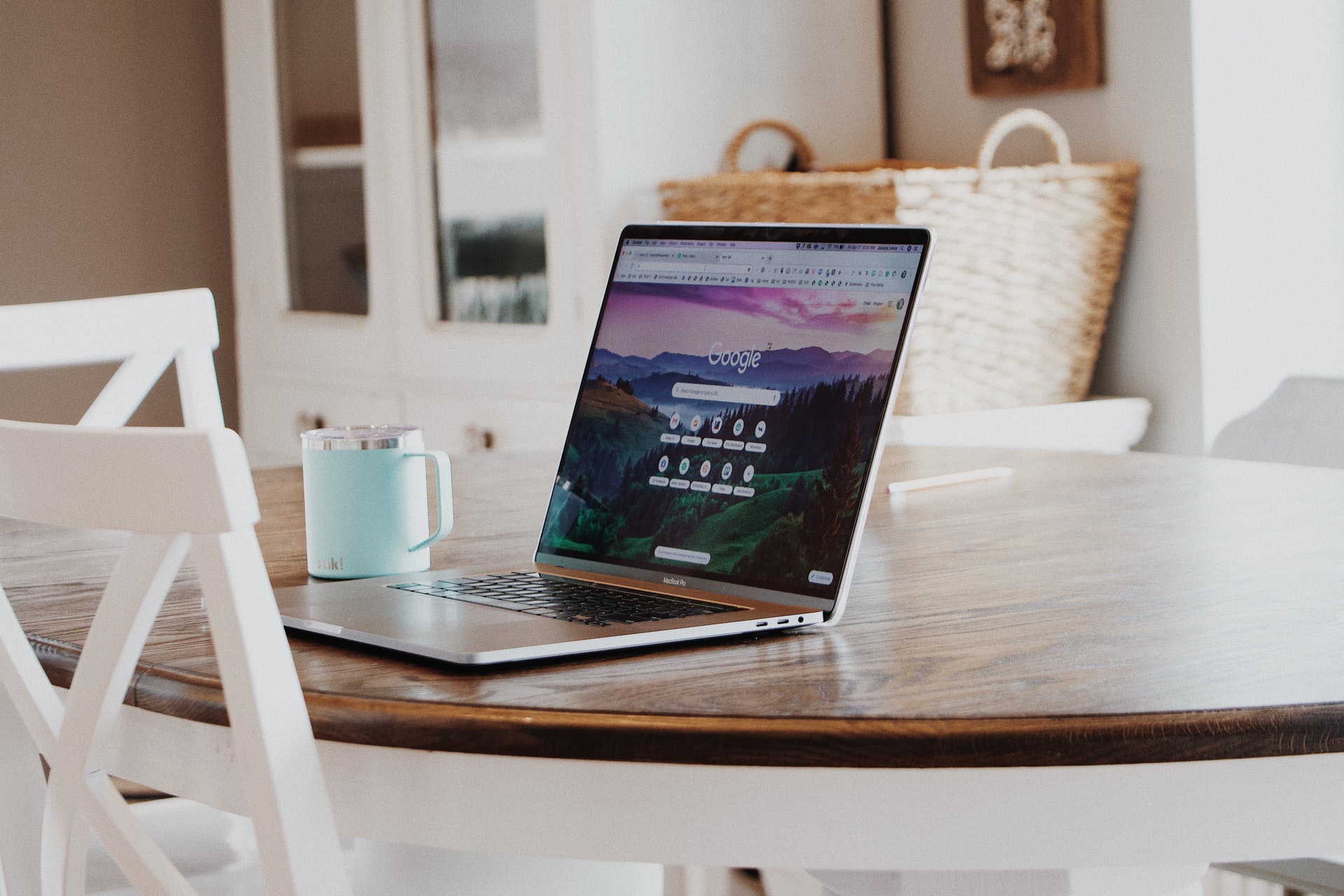 laptop on a table with google visible