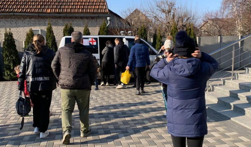 Refugees going to van