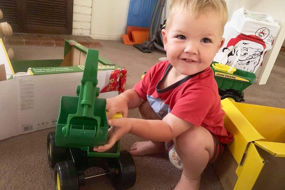 Child play with toy trucks