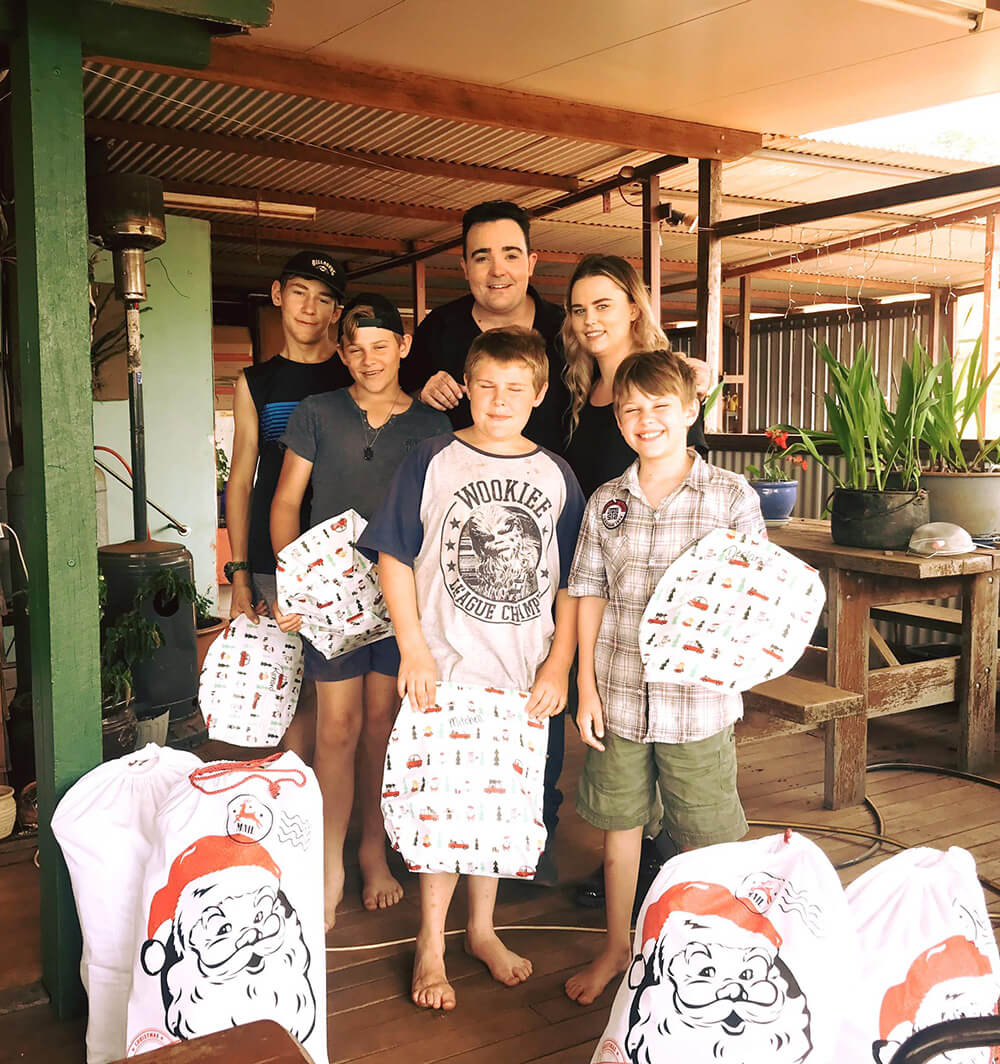 Jason Owen and Becky delivering presents