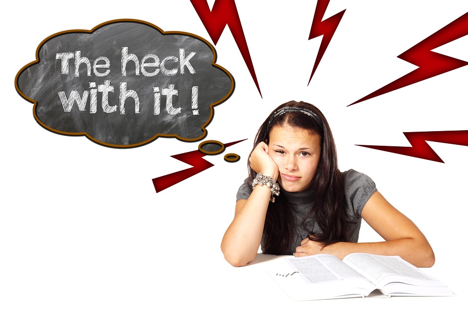 seated girl leaning face on hand thought bubble says THE HECK WITH IT!