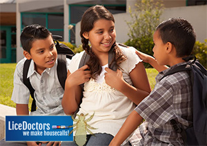 Students talking at school - LiceDoctors