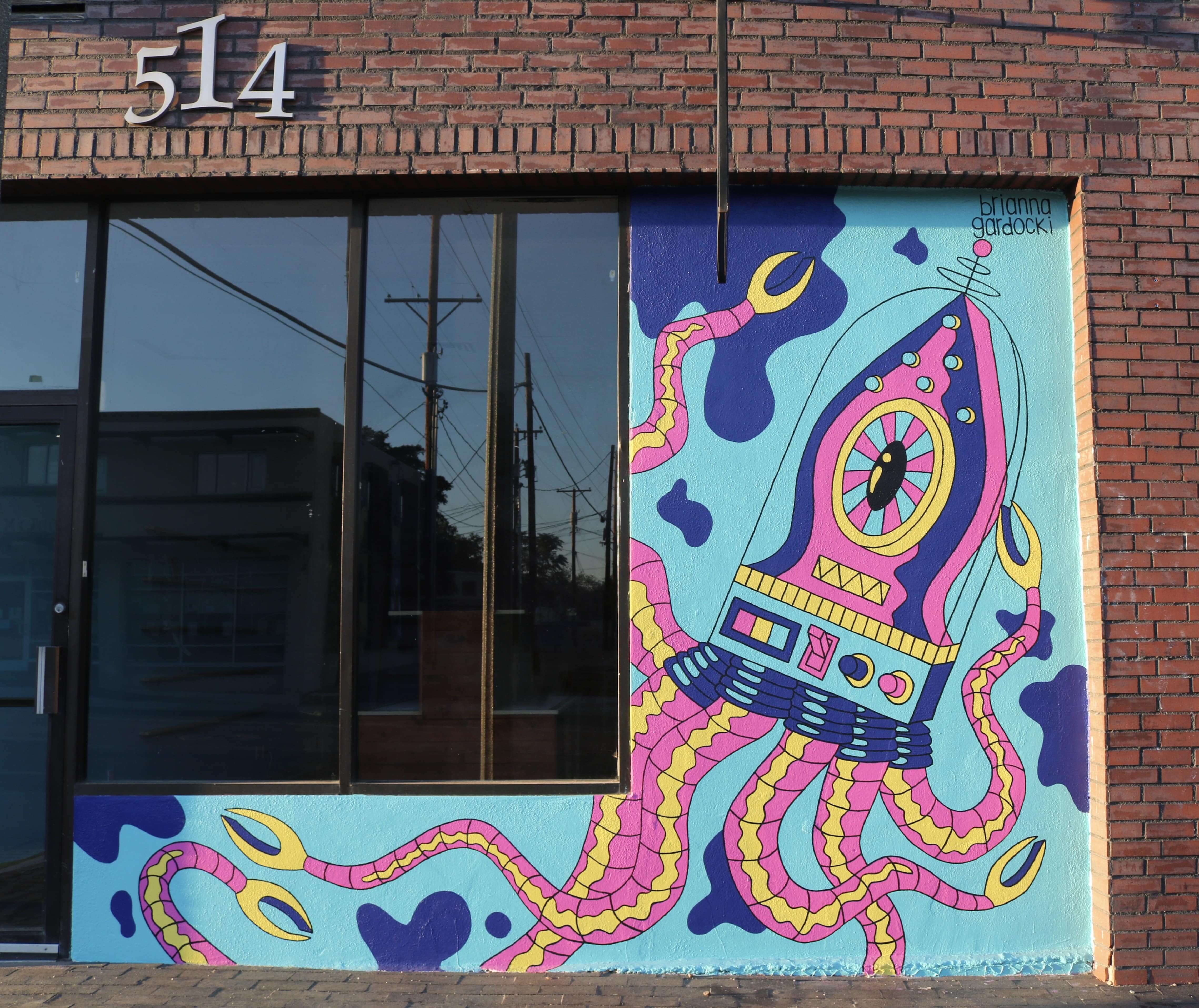 A photo of the completed Squidly Designs mural