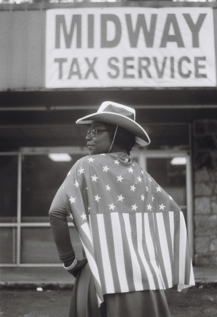 Black women wearing American flag cape