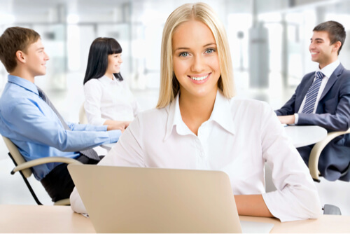 Confident smiling woman in office